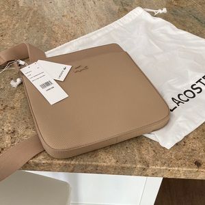 Lacoste cross over bag. Neutral beige